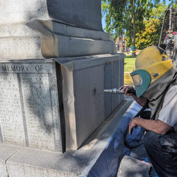 worker adding plaque